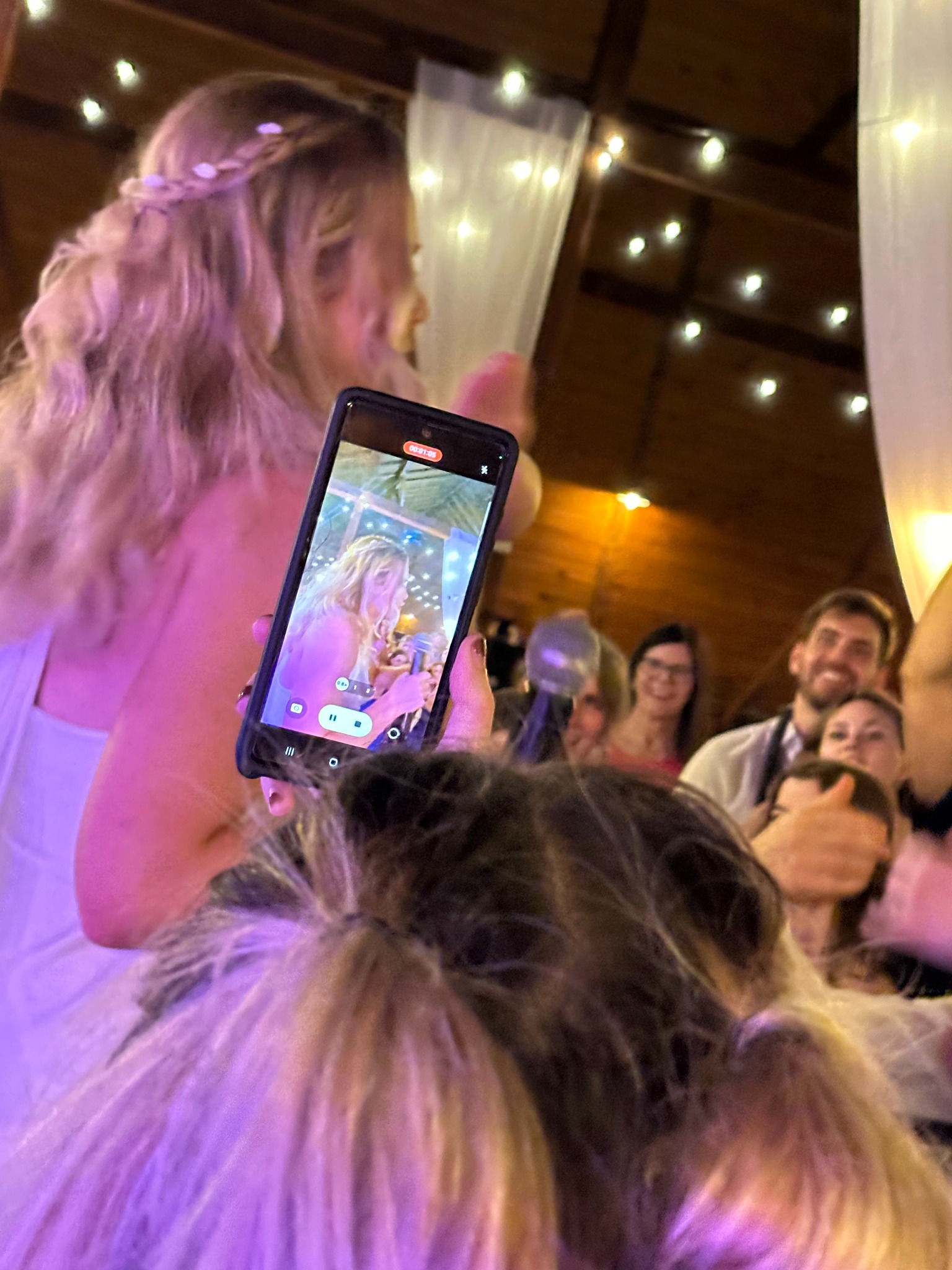 A bride celebrating with guests during a wedding reception